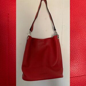 Bright red vegan leather slouchy handbag from Louenhide. Pristine condition.
